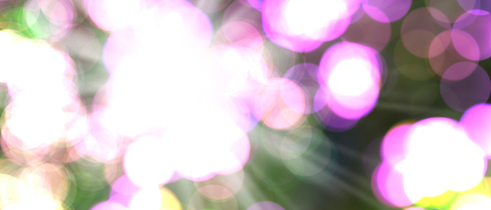 Vibrant and abstract graphic intense saturated bokeh circles and light flares. Color palette dominated by bright magenta vivid pink and brilliant white contrasted with underlying touches of green